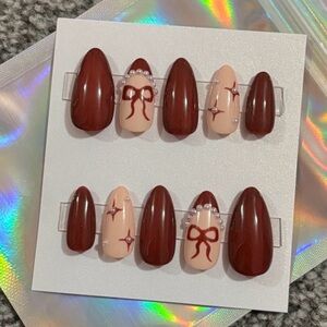 Handmade burgundy almond shaped press on nails with pearls and bow details